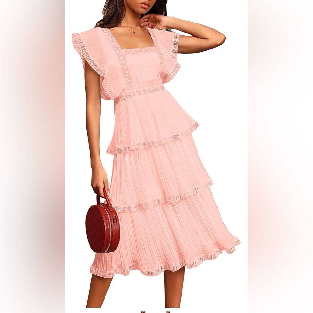 New pink dress, tiered. Never been worn. Tie back on the shoulder area. XL